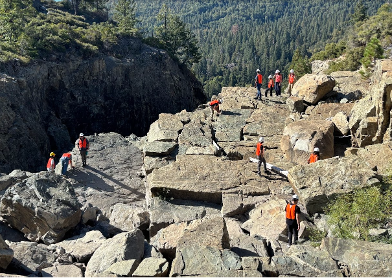 Students in red vests at Spaulding Dam.